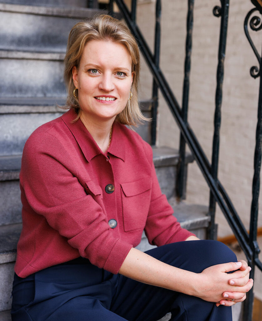 Claudia Timmermans seated on stairs